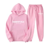 Pink Essentials Hoodie: Soft cotton blend in pastel pink, relaxed fit, perfect for casual outings or lounging at home."