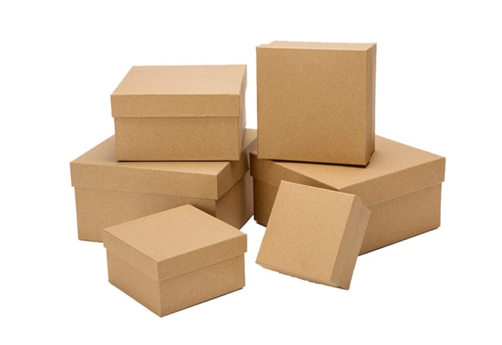 A stack of custom printed kraft boxes arranged neatly, showcasing various designs and sizes.