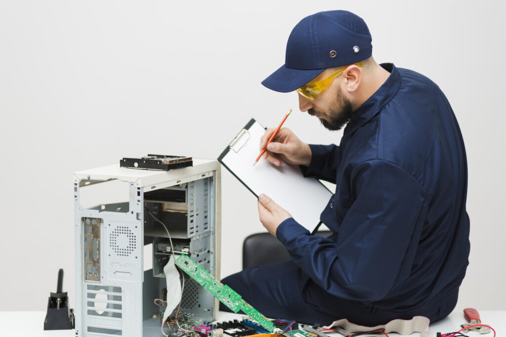 sideways man repairing computer